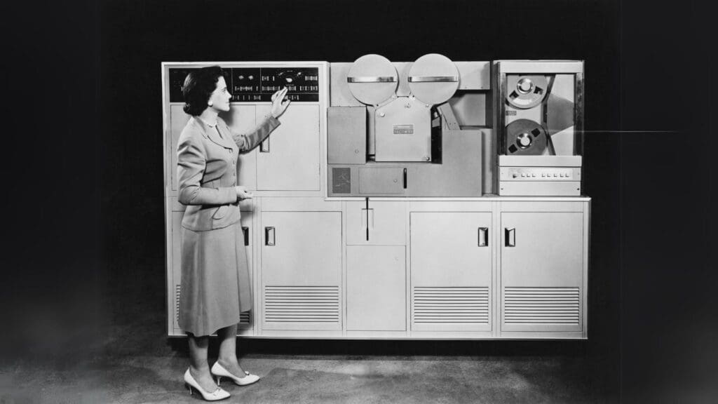 a woman using an original computer